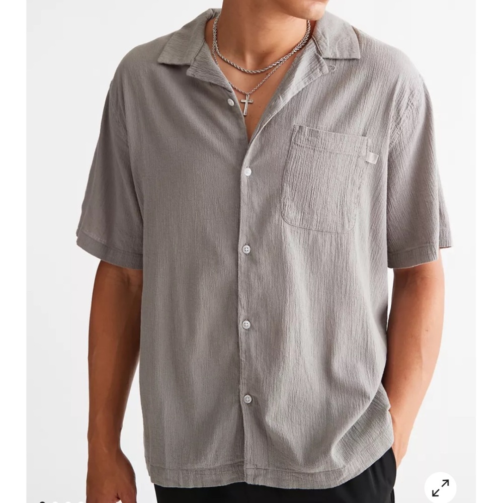 Size medium. Never worn beige standard cloth crinkle button down shirt.